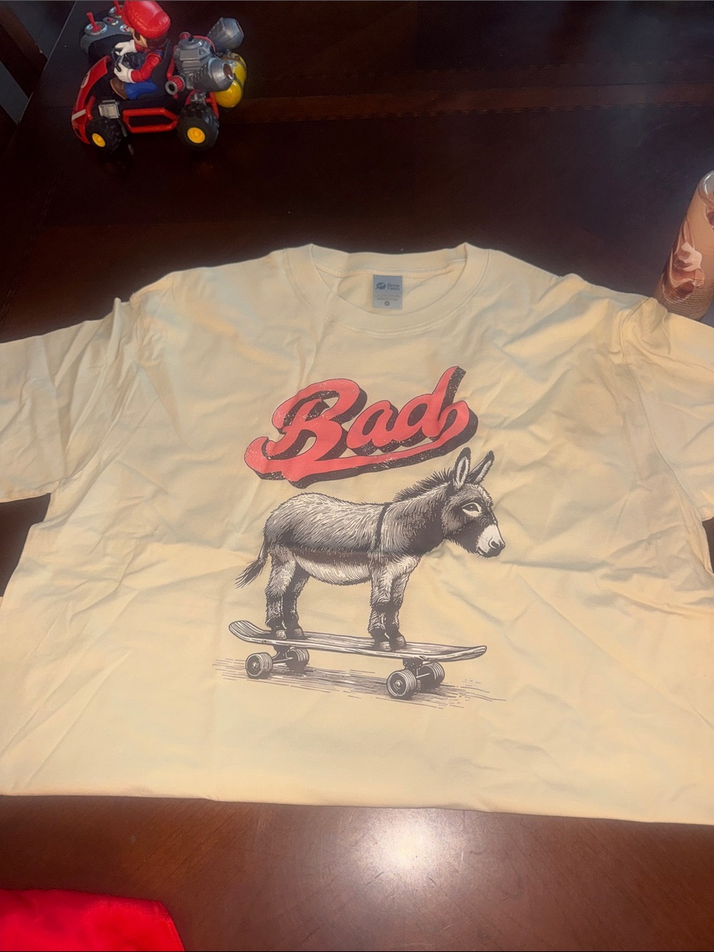 Hanes Cream Short-Sleeve Tee with Red 'Bad' Donkey Skateboard Graphic